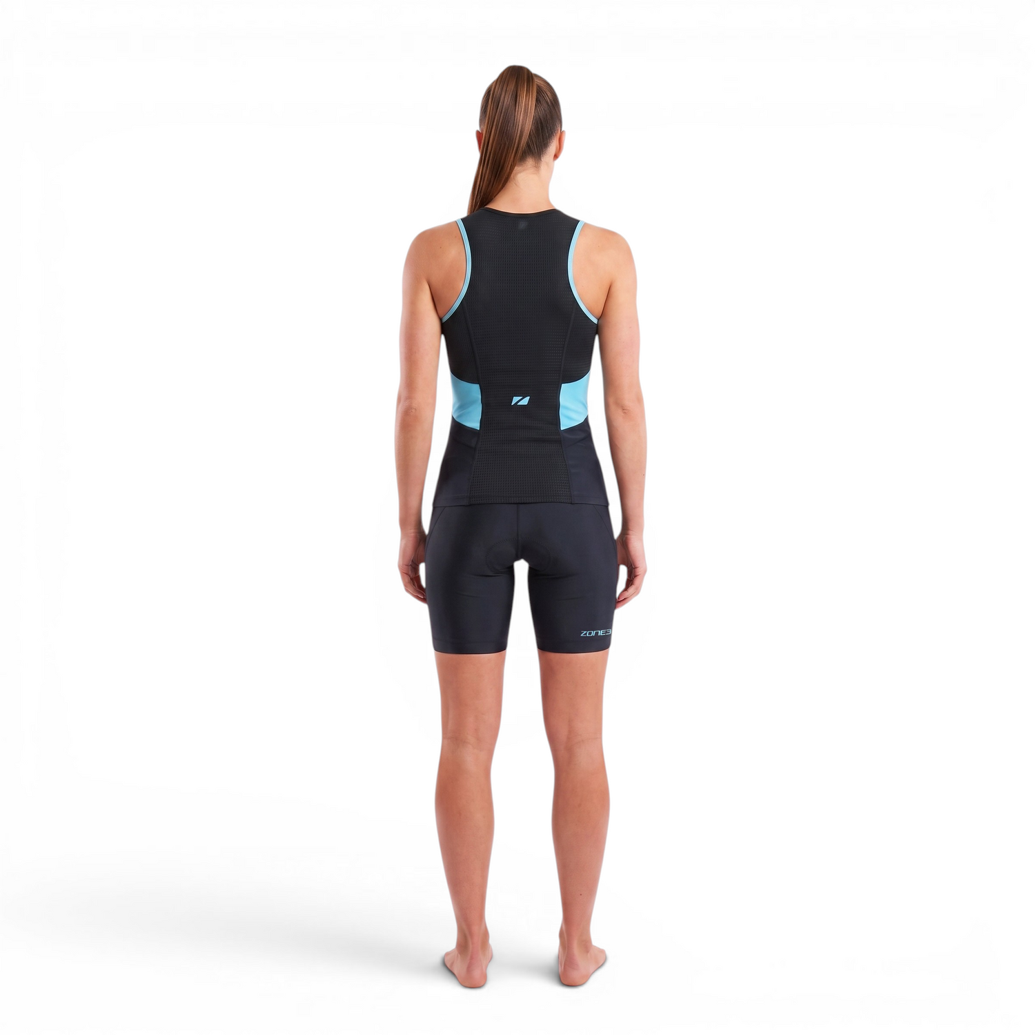 A woman wearing the Zone3 Activate tri top on a white background.