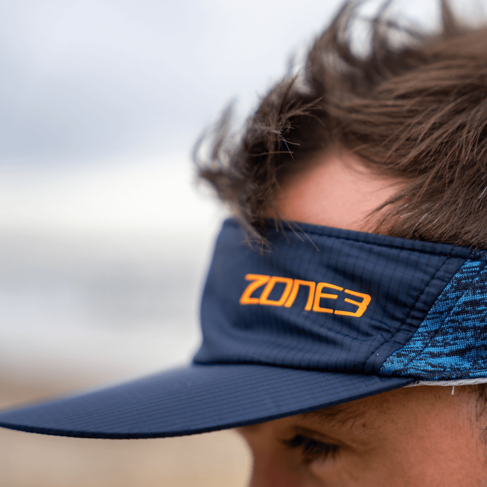 Navy lightweight race visor with orange Zone3 branding.
