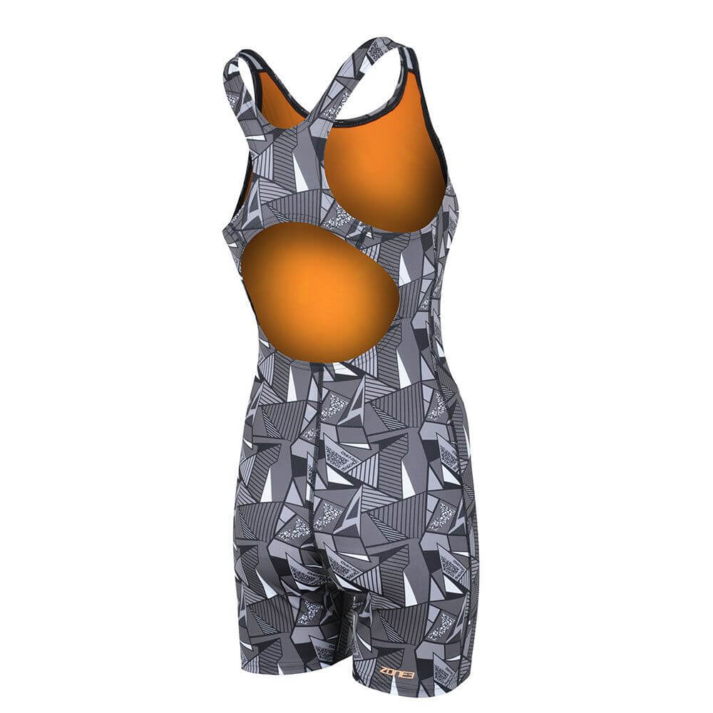 A woman wearing the Zone3 OWS Renew short leg kneeskin swimsuit on a white background.