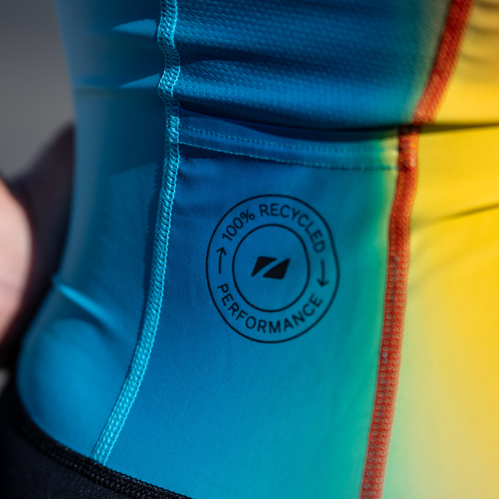 Close-up of the trisuit's rear side panel showing the text 