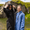 Front view of person wearing Active-Flex changing robe next to another person wearing a thermotech changing robe in blue