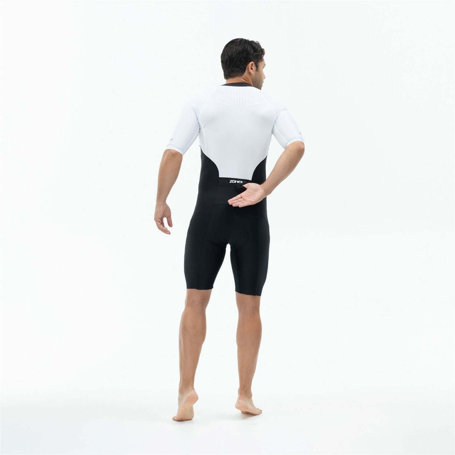A man wearing the Zone3 Lava full zip short sleeve trisuit on a white background.