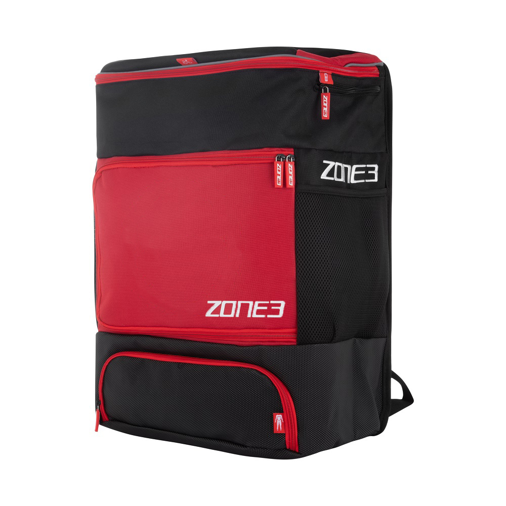 A navy and orange ZONE3 transition backpack with multiple zippers and the brand logo visible on the side.