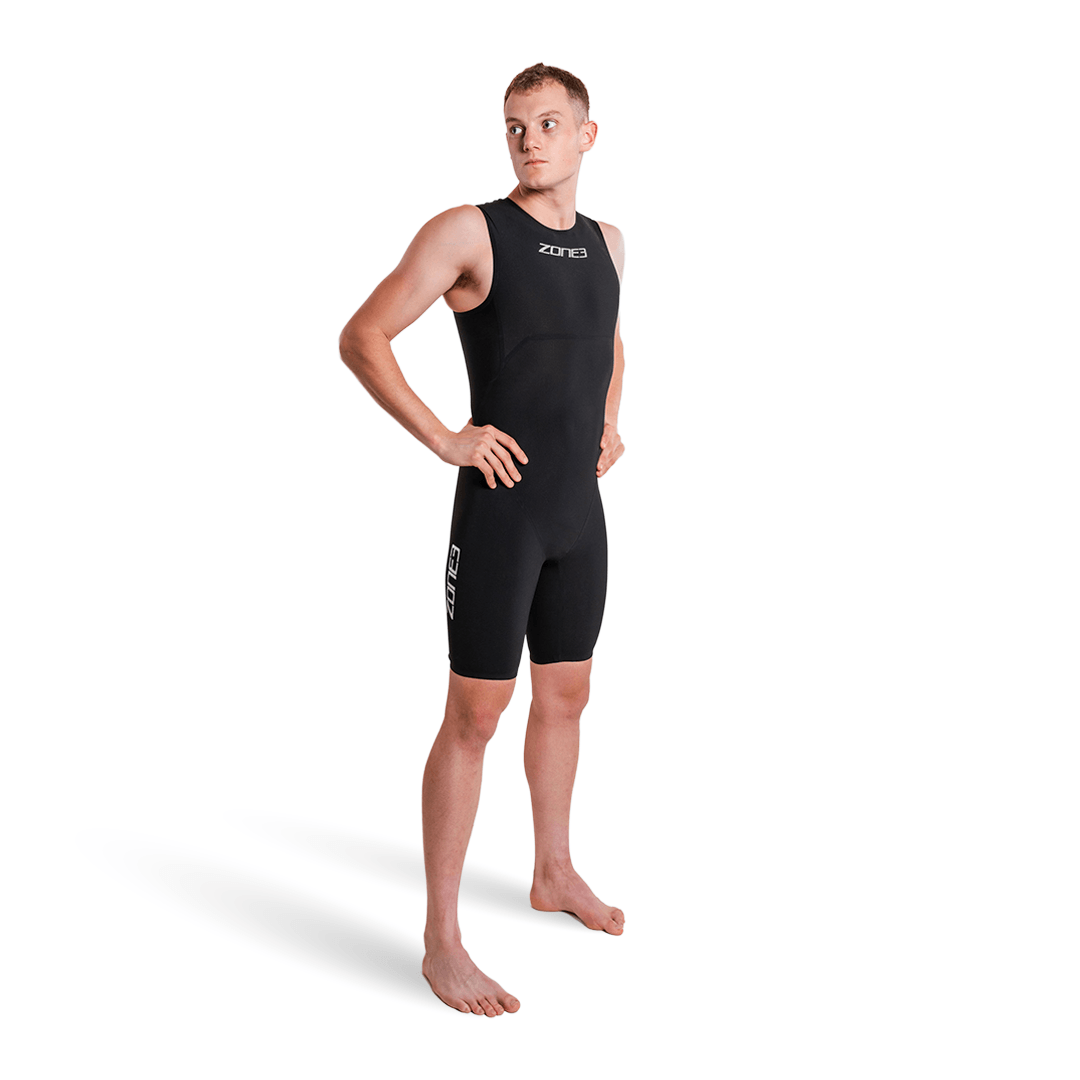 Male model wearing Zone3 Streamline Sleeveless Swimskin in black shown from the side with logo on the chest.