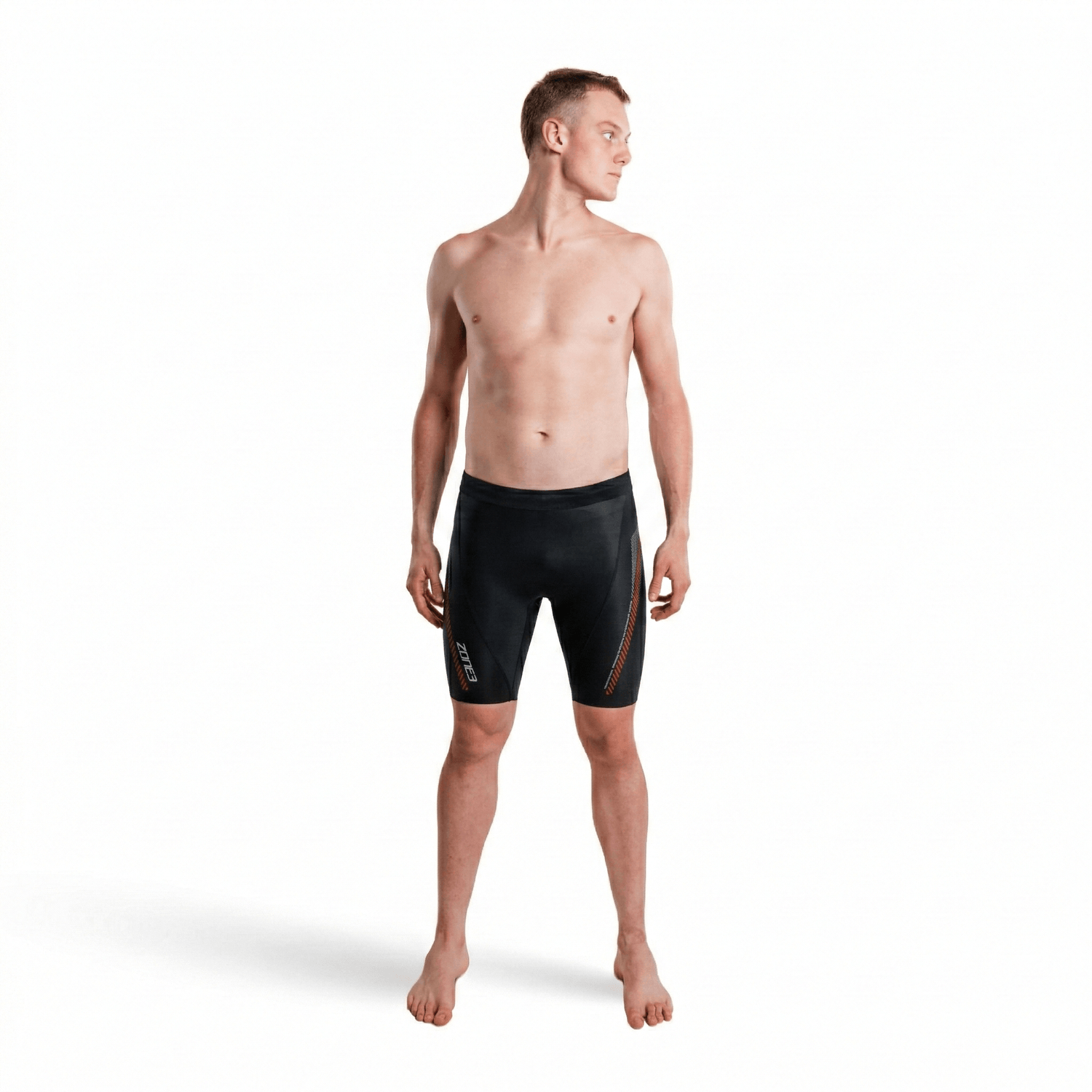 Front view of a shirtless man wearing premium 5/3mm buoyancy shorts in black with red panel accents.